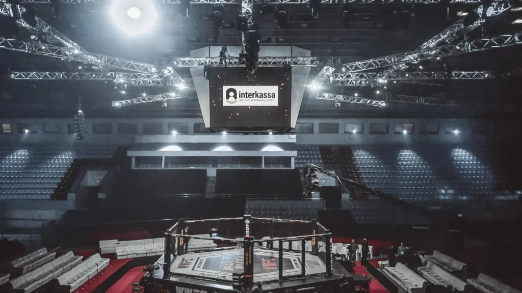A fighting venue with an octagon in the middle