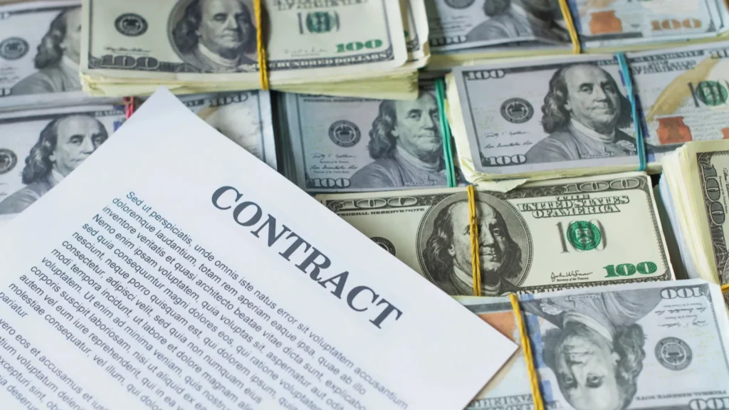 High angle shot of money and a contract