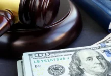 Police arrest Argentine YouTubers who allegedly bypassed stadium security at a World Cup game Gavel and dollar banknotes