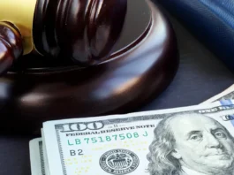 Police arrest Argentine YouTubers who allegedly bypassed stadium security at a World Cup game Gavel and dollar banknotes