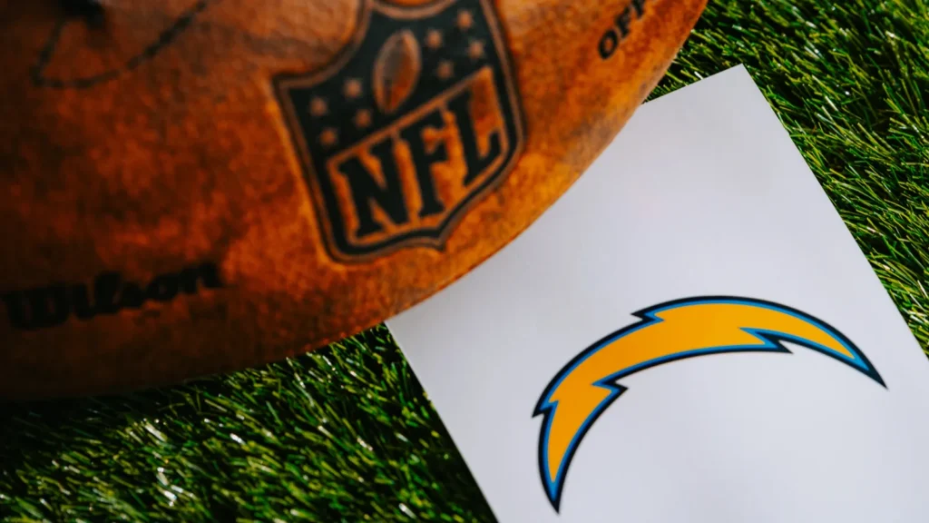 Los Angeles Chargers logo next to a NFL football