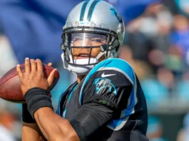 Cam Newton throws a pass