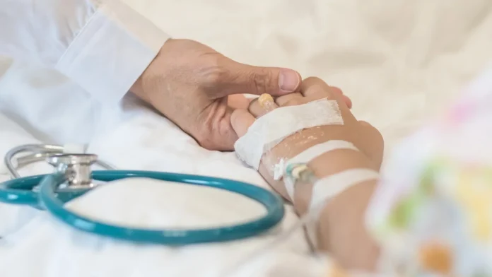 nursing caretaker concept with kid patient sleeping in bed with