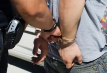 Officer arresting young man
