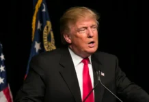 Donald Trump at a podium.