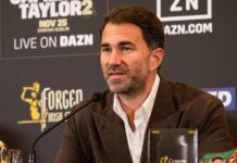 Eddie Hearn gives a major update on Tom Aspinall’s future in the UFC after eye surgery scare Eddie Hearn speaking into a microphone at a press conference, with a DAZN-branded backdrop behind him