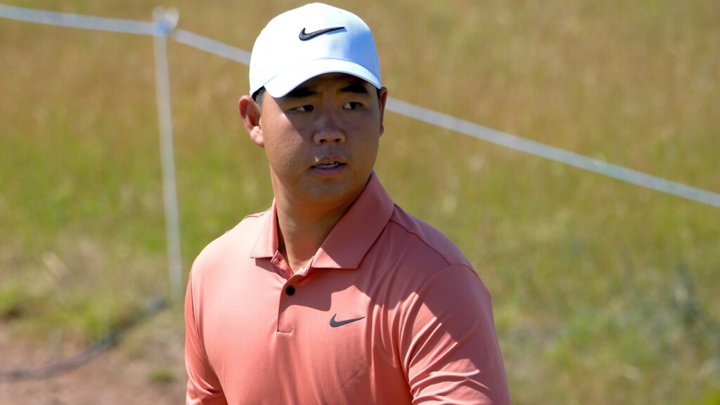 Professional golfer Tom Kim wearing a Nike polo and cap