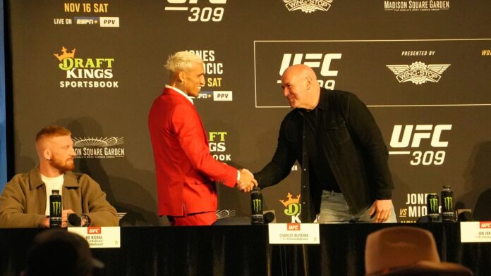 Charles Oliveira shaking Dana White's hand