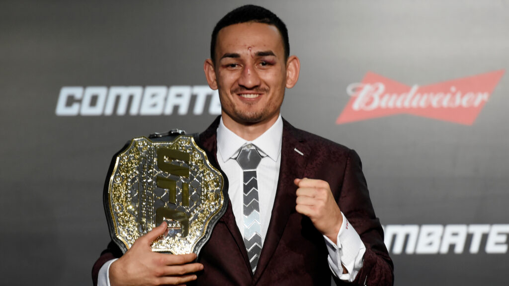 Max Holloway with his championship belt