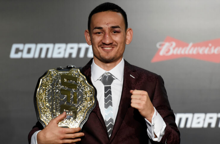 Max Holloway with his championship belt