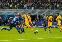Soccer match being played between two teams.