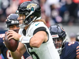 trevor lawrence of the jacksonville jaguars is sacked by chris