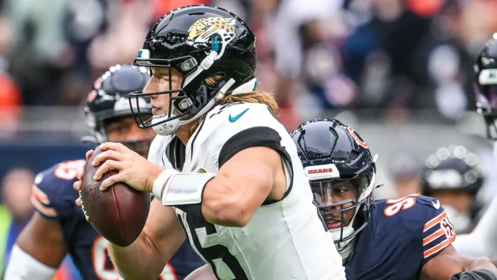 trevor lawrence of the jacksonville jaguars is sacked by chris