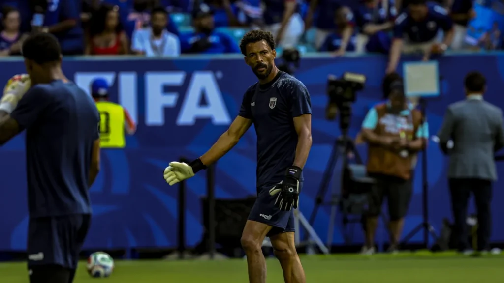Cape Verde goalkeeper Vozinha warming up in a dark blue Capelli Sport shirt before a 2026 FIFA World Cup match