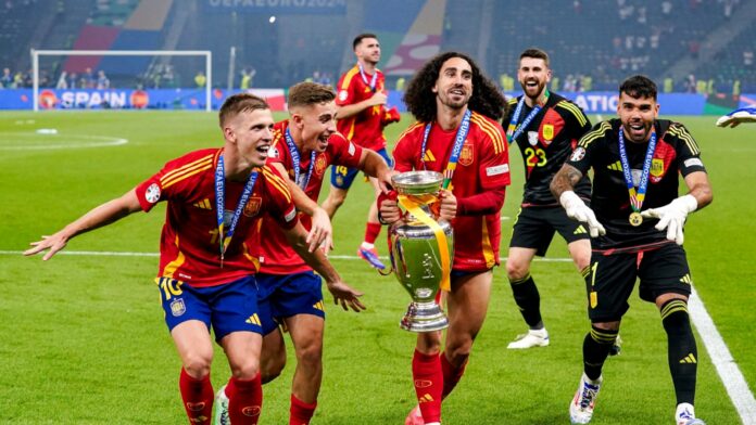 Shutterstock_2489335767 Dani Olmo, Fermin Lopez, Marc Cucurella holding the trophy, David Raya celebrating victory, Unai Simon, David Raya during the UEFA EURO 2024 Final match Spain v England