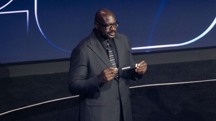 Shaquille O’Neal assists during the 2026 FIFA World Cup draw at the John F. Kennedy Center for the Performing Arts in Washington, DC.