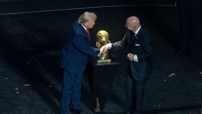 Shutterstock_2710787633 FIFA President Gianni Infantino presents the Peace Prize to President Donald Trump during the 2026 FIFA World Cup.