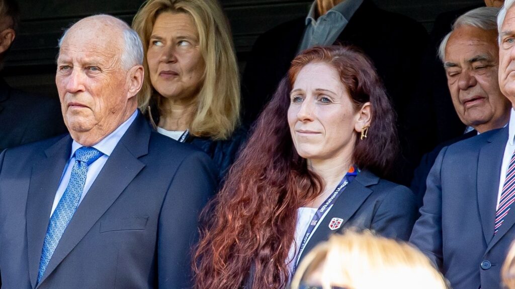 King Harald and Lise Klaveness attending a football game.