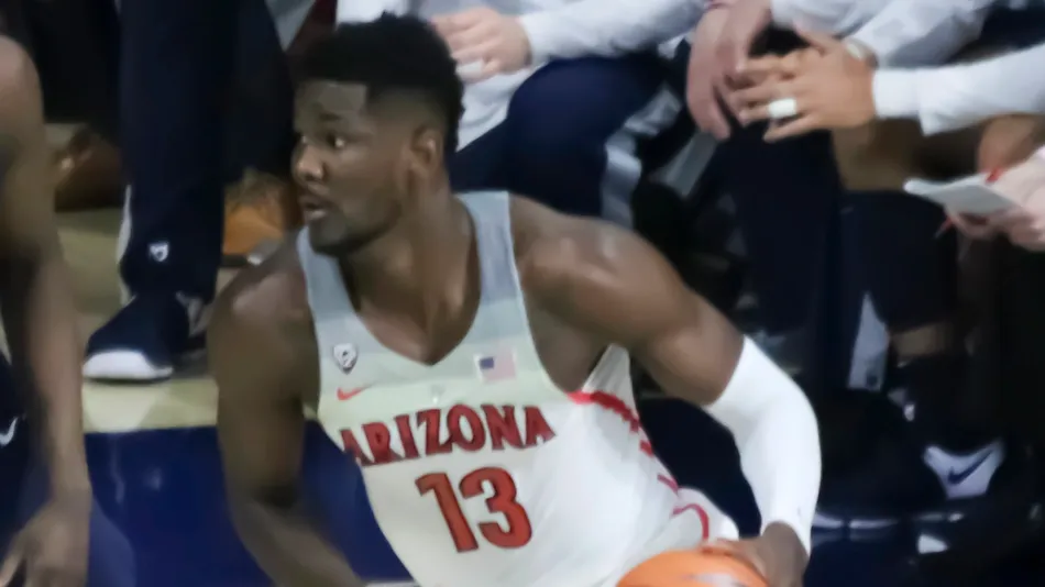 arizona forward deandre ayton seeks to evade two uconn defenders