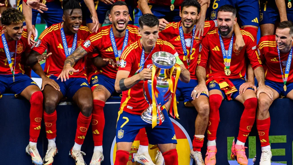 Spanish national football team players celebrating with the Henri Delaunay Trophy after winning the UEFA Euro 2024 final