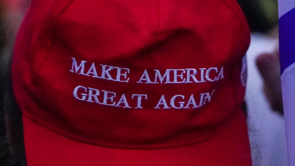 Red baseball cap features the white embroidered slogan "Make America Great Again