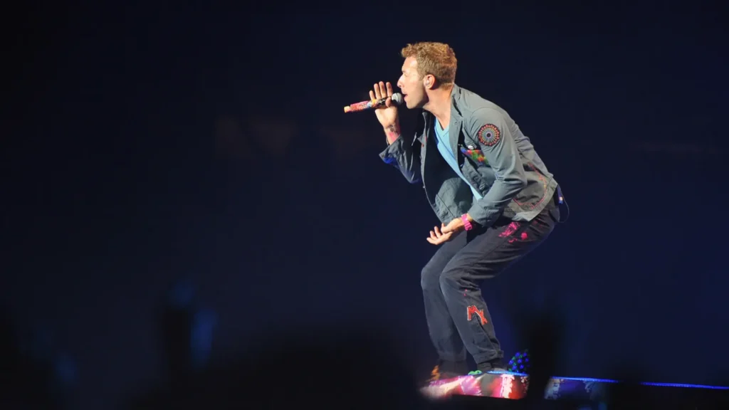 Chris Martin of Coldplay performing on the Music of the Spheres World Tour