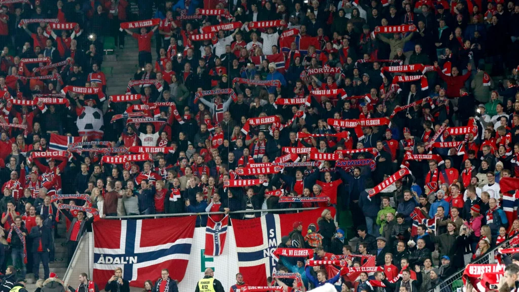 Fans cheering at a Norway national football team match