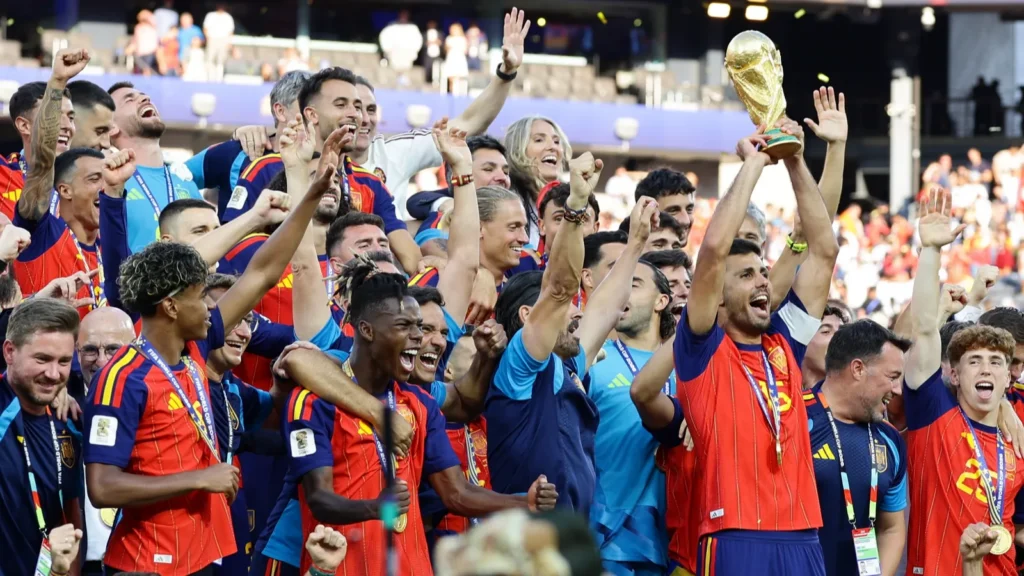 Football Spain team lifting up the World Cup trophy.