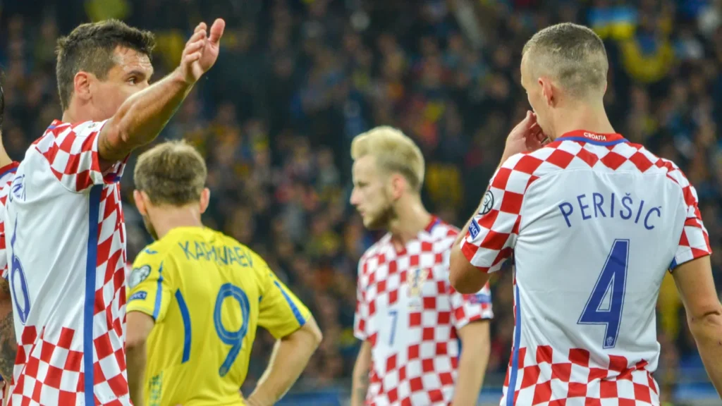 Ivan Perišić, wearing the Croatia national team's checkered jersey with his name and number 4 on the back