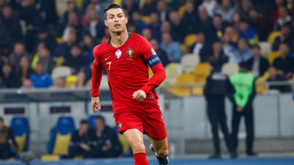 Cristiano Ronaldo wearing a red Portugal national team jersey