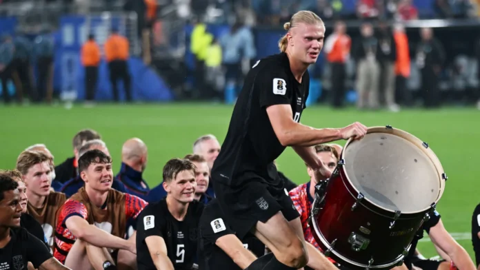 Erling Haaland celebrating with a drum alongside his Norwegian teammates Erling Haaland celebrating with a drum alongside his Norwegian teammates