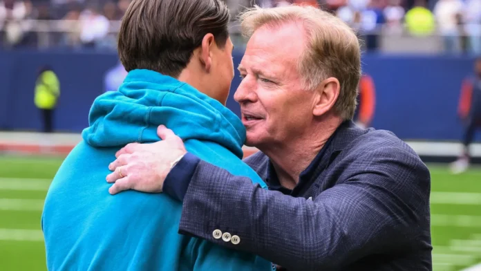 NFL Commissioner Roger Goodell embraces Louis Reeszammit of the Jacksonville