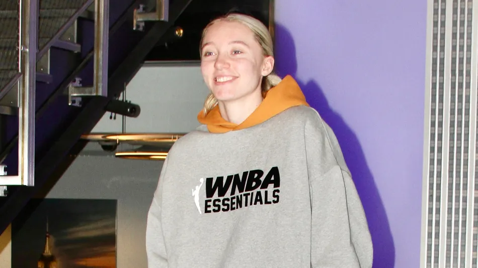 Paige Bueckers is featured wearing a gray WNBA Essentials pullover hoodie