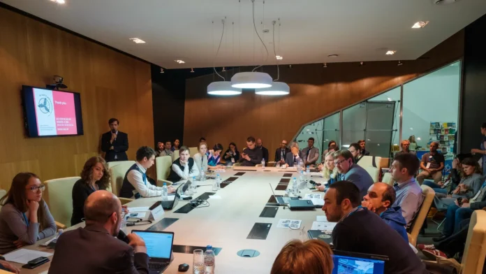 people at round table session