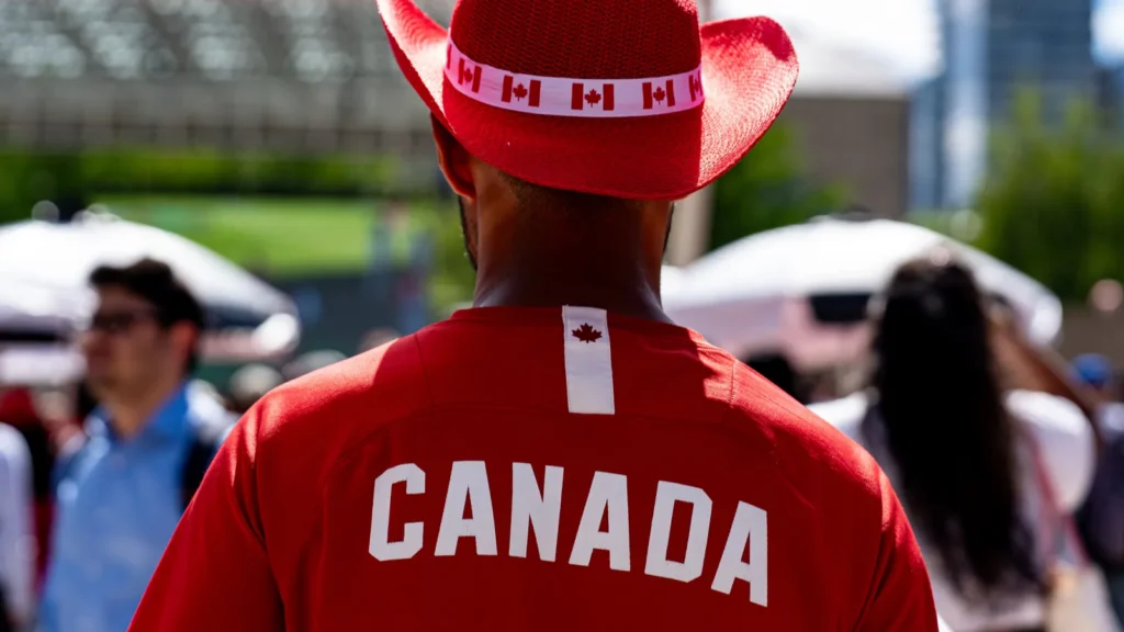 rear view of canada fan wearing red cowboy hat at