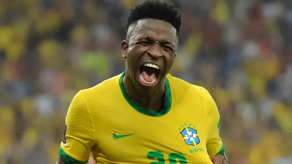 Vinícius Júnior celebrating in a Brazil national team jersey