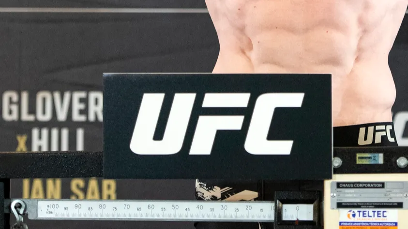 UFC fighter on a weighing scale