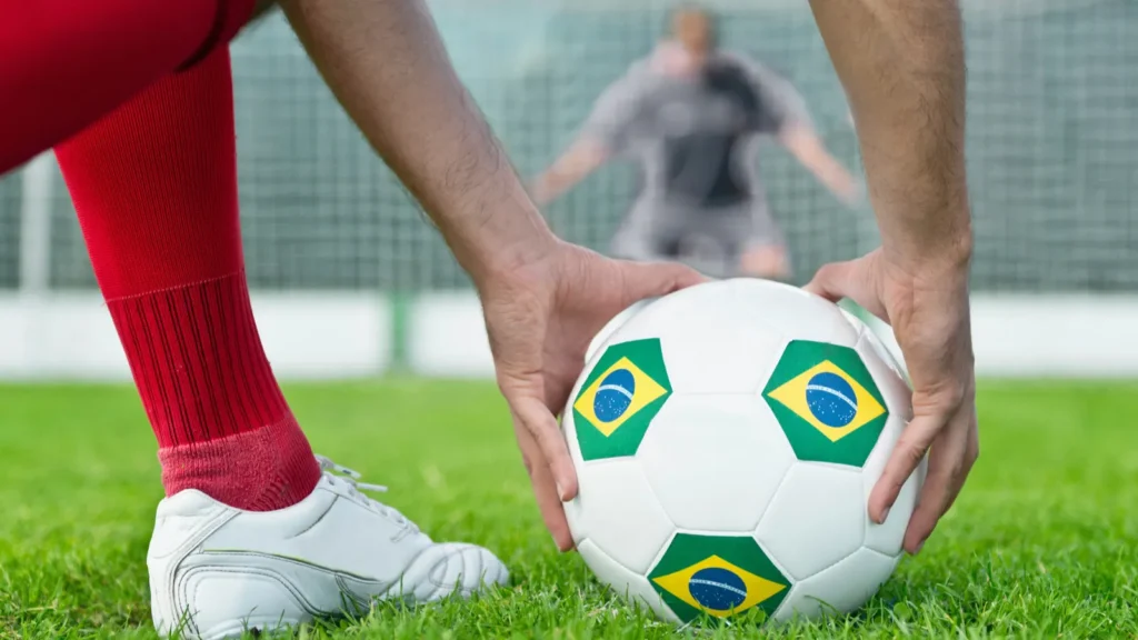 Striker placing ball.