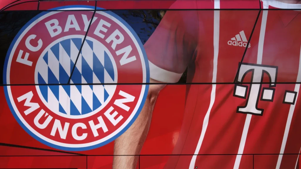 FC Bayern Munich logo and a partial view of their red jersey