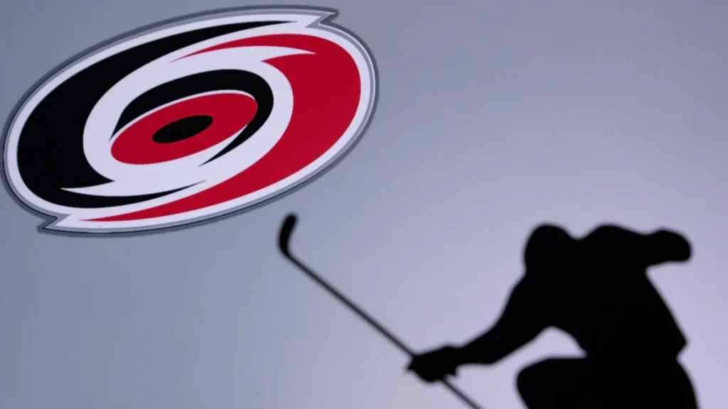 Carolina Hurricanes logo with a silhouette of a player