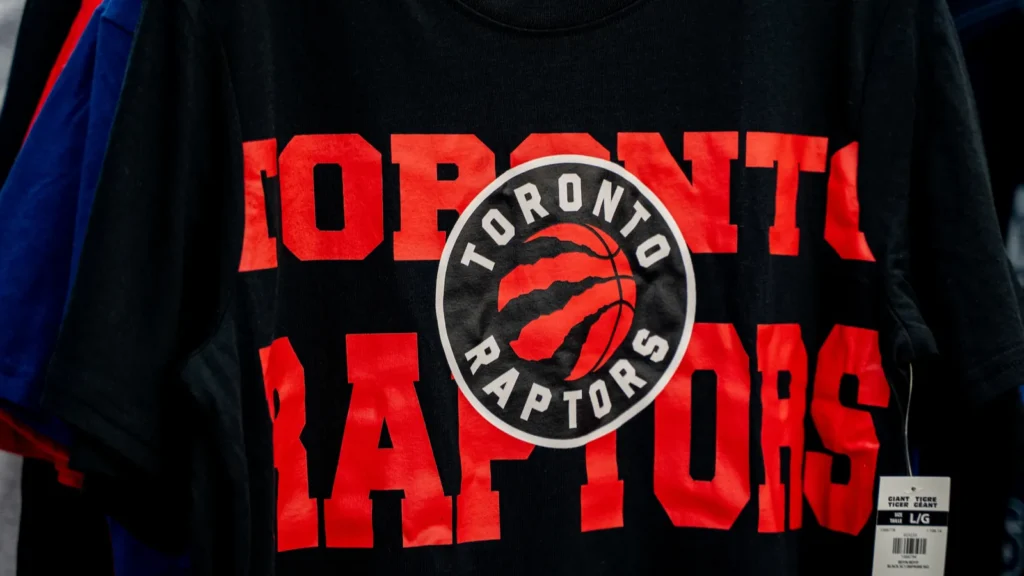 Toronto Raptors logo T-shirt displayed in a retail store