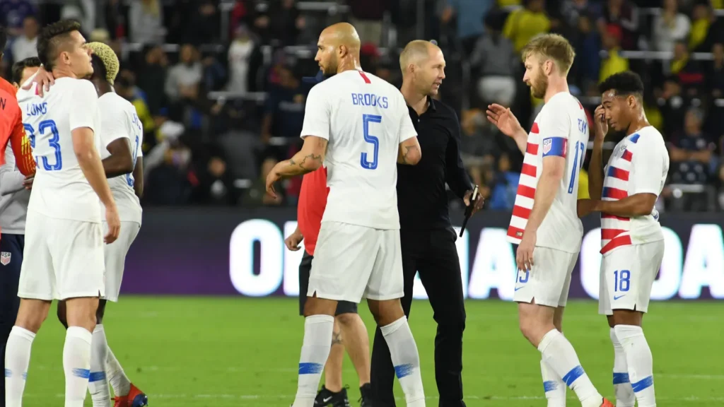 John Brooks of USMNT greeting referee post football match.