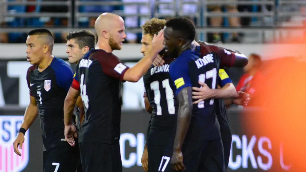 USA soccer team celebrating a goal