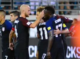 USA soccer team celebrating a goal