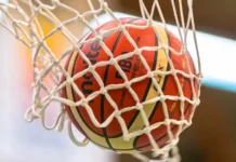 A basketball through a hoop