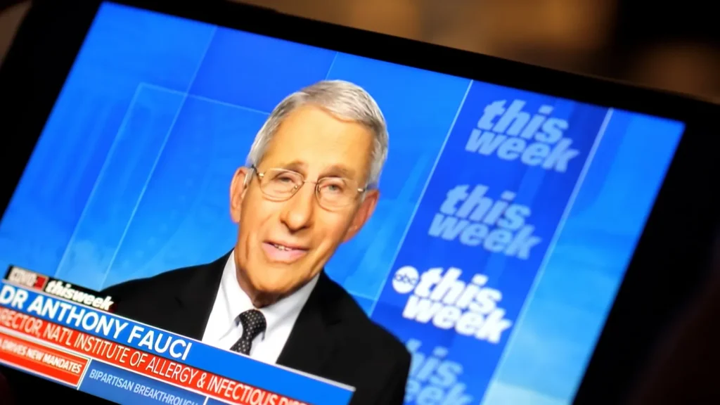 Dr. Anthony Fauci speaking during a televised interview on a news program.