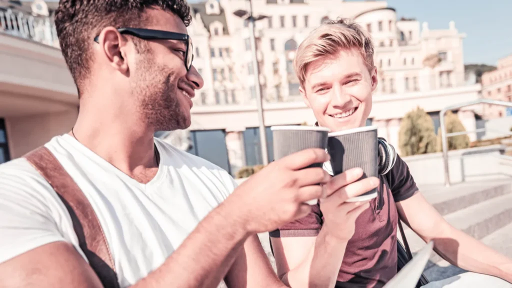 attractive blonde man keeping smile on his face