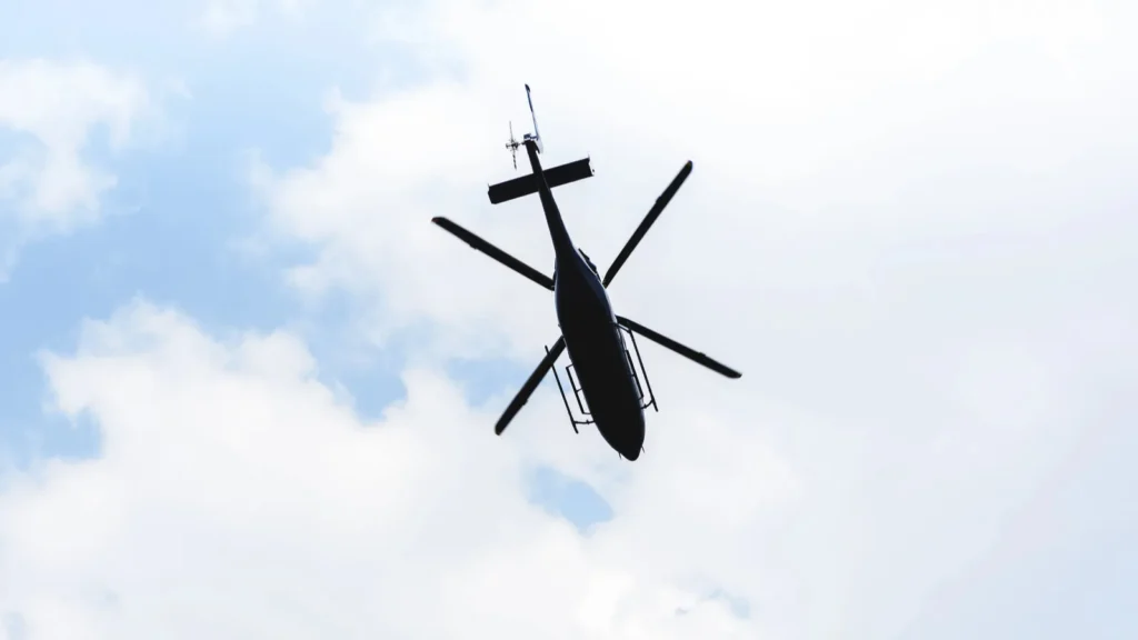 Bottom view of a helicopter flying in sky