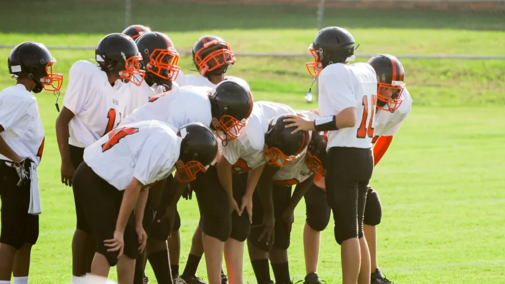 boys playing american football