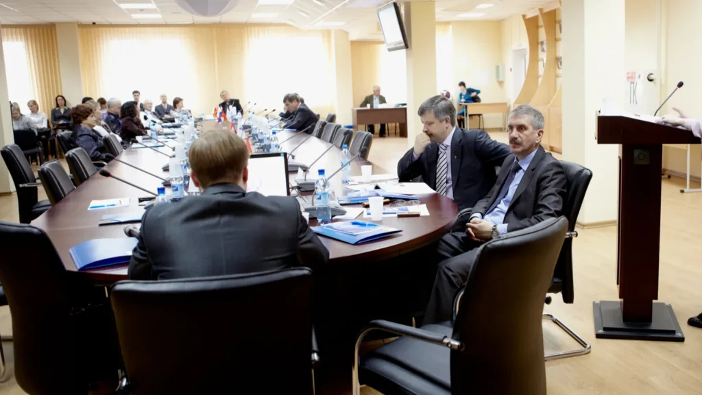 during presentation. People at a board meeting.